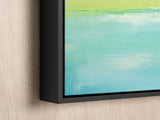 a painting hanging on a wall with a black frame