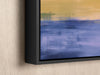 a painting hanging on a wall with a black frame