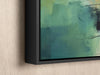 a painting hanging on a wall with a black frame