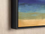 a painting hanging on a wall with a black frame