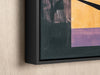 a painting hanging on a wall with a black frame